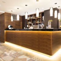 In-ceiling speakers in a hotel bar area.