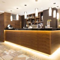 In-ceiling speakers in a hotel bar area.